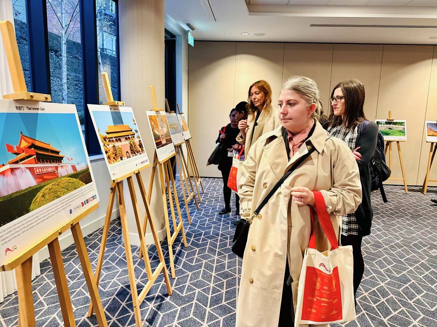 Guests viewing the Beijing tourism photo exhibition in Dublin